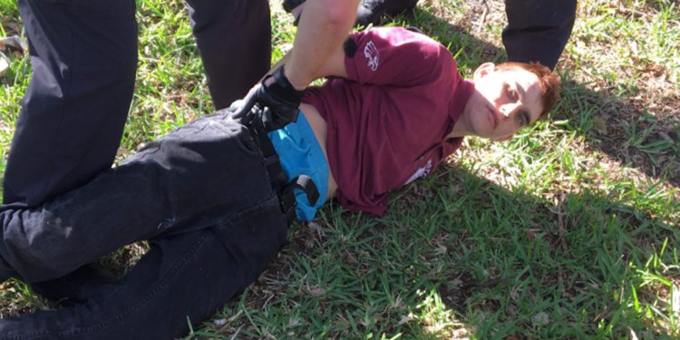 Nikolas-Cruz laying on the ground